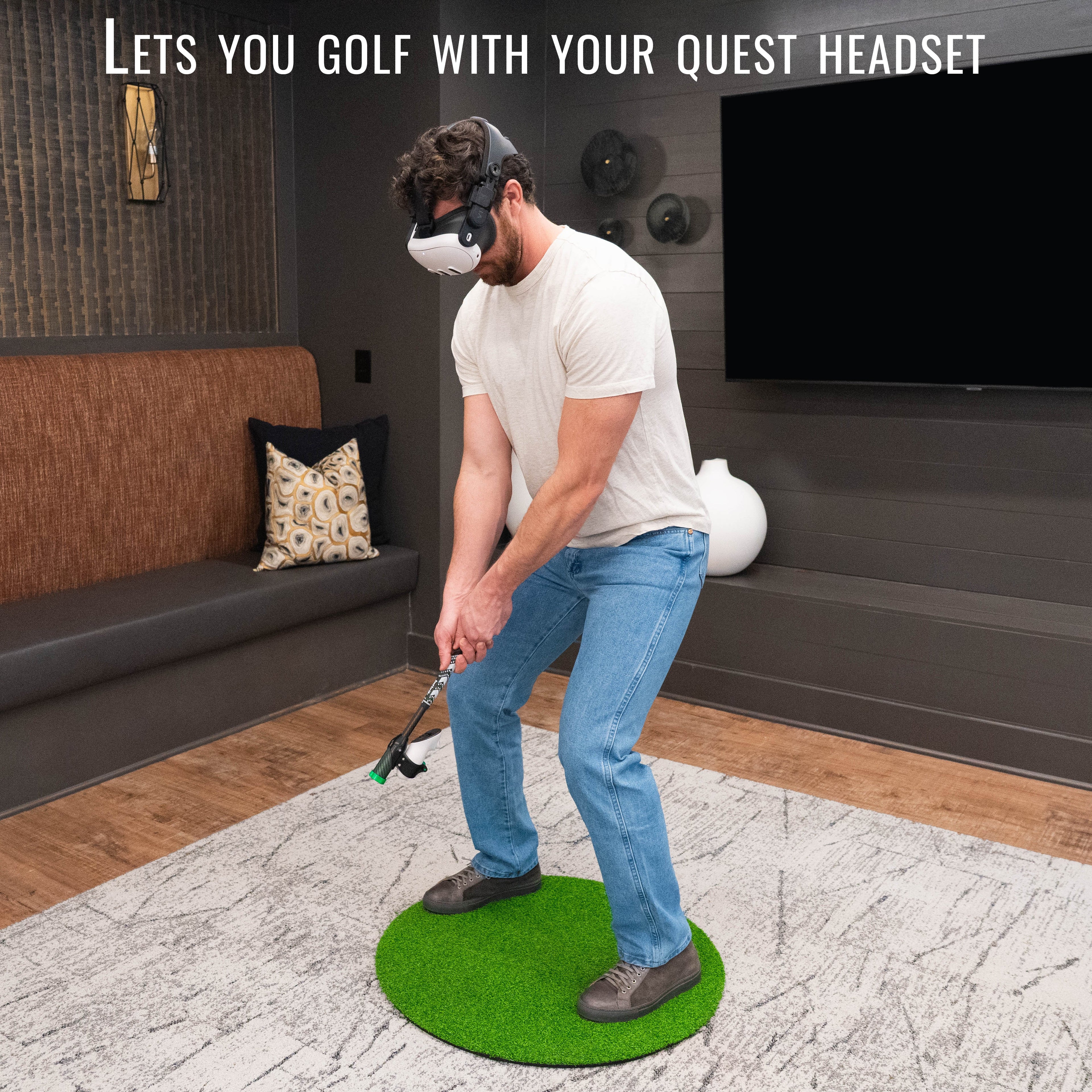 Man using a virtual reality headset to play golf indoors.
