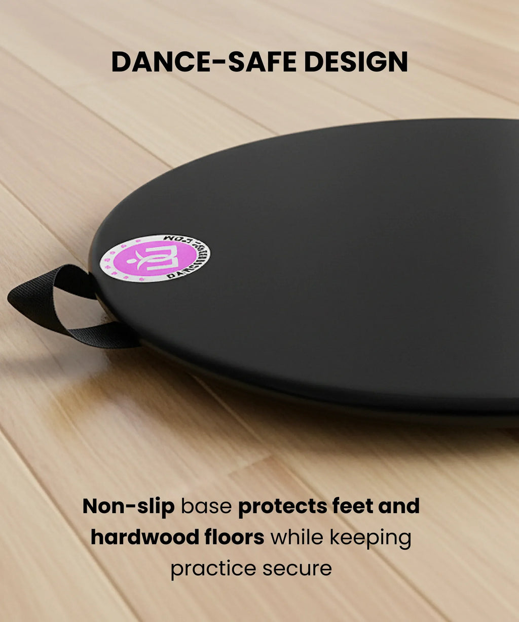 Black dance mat with a non-slip base on a wooden floor, featuring a brand logo.