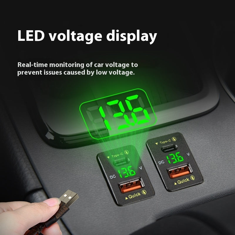Car voltage monitor with LED display showing voltage readings on a car dashboard.